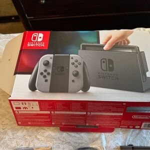 Nintendo Handheld Gaming Console with Black Controllers